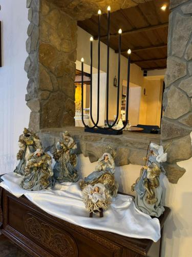 a group of angels sitting on a table in a room at Hotel Amalia in Smokovce