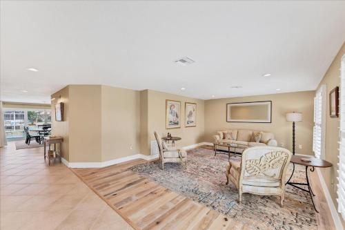 a living room with a couch and a table at 803 Napoli in Punta Gorda