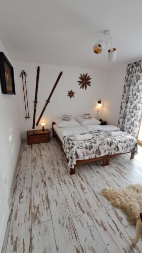 Ein Bett oder Betten in einem Zimmer der Unterkunft Apartamenty Baj na Polnej -Górski Azyl