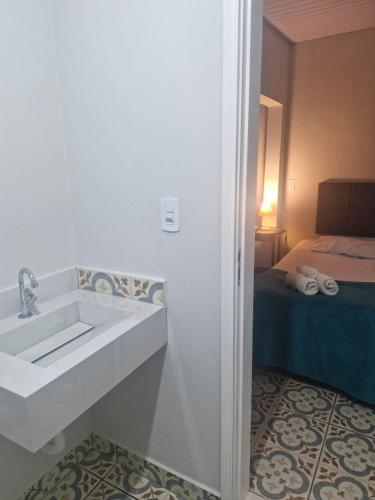 Ένα ή περισσότερα κρεβάτια σε δωμάτιο στο Flat Casa Grande