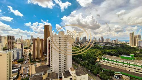 a view of a city with a roller coaster at Coruja Imob - Flat Crystal Place in Goiânia