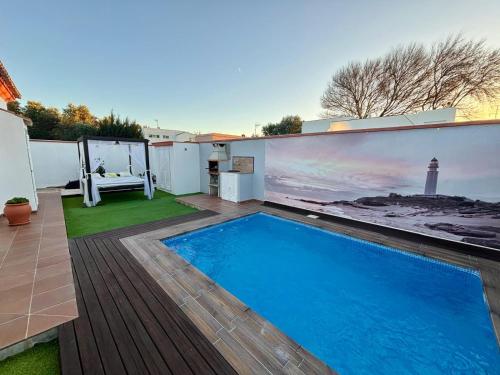 a swimming pool on the roof of a house at Casa Moisés Atardecer in El Palmar