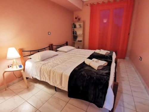 Ένα ή περισσότερα κρεβάτια σε δωμάτιο στο Serenity LX Apartments II