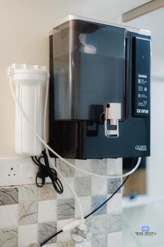 a microwave oven sitting on top of a counter at Bigson Blissful Studios in Hyderabad