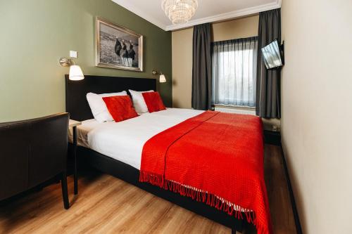Ένα ή περισσότερα κρεβάτια σε δωμάτιο στο Hotel Renesse