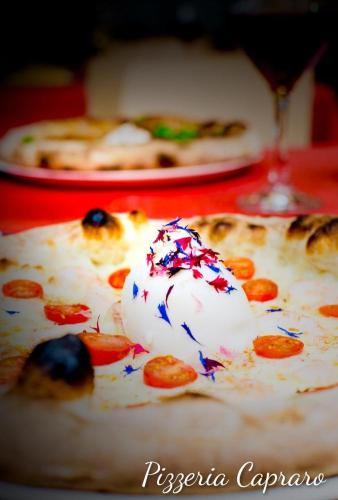 a slice of pizza with red white and blue sprinkles at B&B l'angoletto in Trebisacce