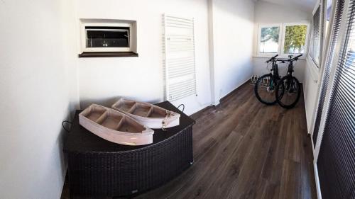 a room with a boat on the wall next to a bike at Chalupy Severní in Lobendava