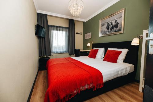 Ένα ή περισσότερα κρεβάτια σε δωμάτιο στο Hotel Renesse