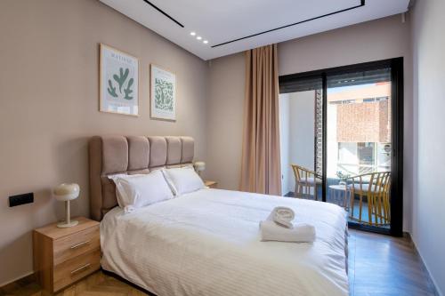 Postel nebo postele na pokoji v ubytování TT Holidays Modern Apartments Rabat City Center