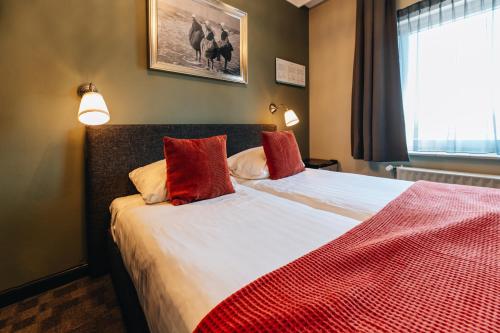 Ένα ή περισσότερα κρεβάτια σε δωμάτιο στο Hotel Renesse