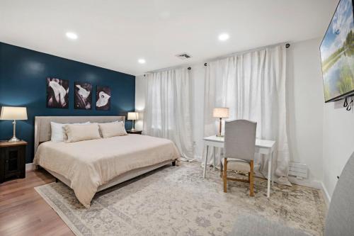 a bedroom with a bed and a desk in it at Family Friendly 3BD Oasis-Parking, WIFI & Pets OK! in Salem