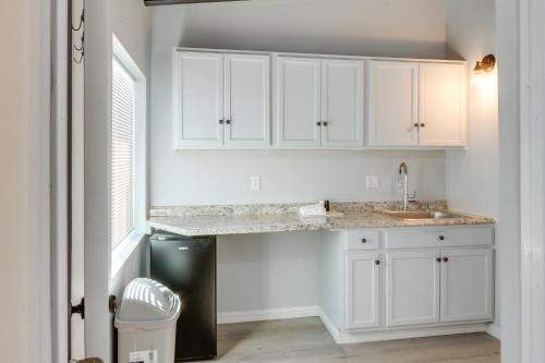 a kitchen with white cabinets and a sink at 6 Mi to Hiking Apartment in Frazier Park in Frazier Park