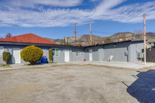 a blue building with a chair in a parking lot at Hike and Explore Studio Stay in Frazier Park in Frazier Park