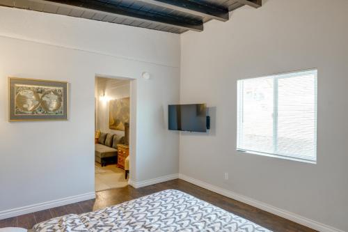 a white room with a tv and a window at Hike and Explore Studio Stay in Frazier Park in Frazier Park