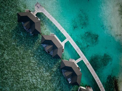 an aerial view of a island in the water at Cinnamon Dhonveli Maldives in North Male Atoll