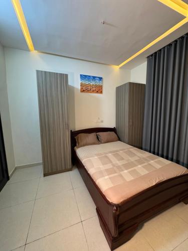 a bedroom with a bed in a room at Résidence TK House in Cotonou