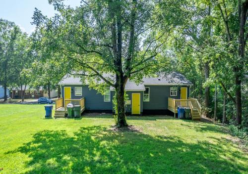 a house with a playground in a yard at 15% off! Front porch w/ Wi-Fi & Private Parking in Gibsonville
