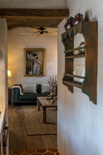 a living room with a couch and a table at Kassandra Heritage in Fethiye