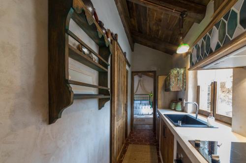 a kitchen with a sink and a counter top at Kassandra Heritage in Fethiye