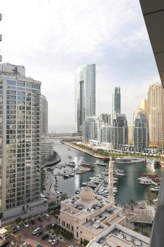 a view of a river in a city with buildings at LUXURY 1BED MARINA VIEW JBR BEACH POoL PARKING in Dubai