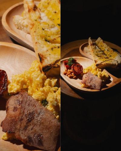 two plates of breakfast food on a table at RINDANG Glamping in Tlekung
