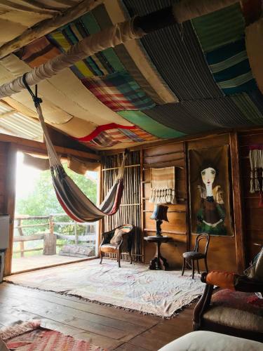 a room with a hammock hanging from the ceiling at Casa Sito in Suesca