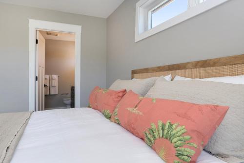 a bedroom with a bed and a window at The Birches in Lake Leelanau