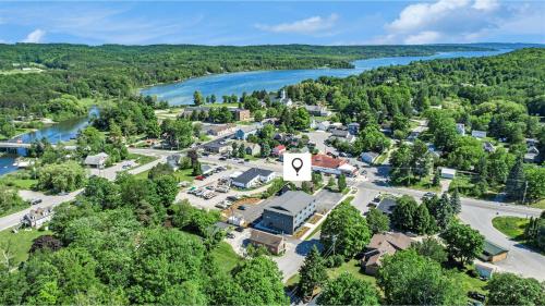 an aerial view of a town with a river at The Birches in Lake Leelanau