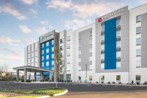 an rendering of a hotel building with a parking lot at Candlewood Suites Chattanooga Hamilton Place by IHG in Chattanooga