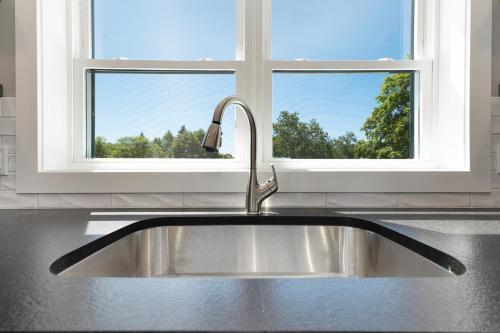 a sink in a kitchen with a window at The Birches in Lake Leelanau
