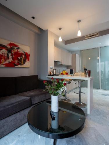 a living room with a couch and a table at The Fourteen Luxury Boutique Hotel in Casablanca