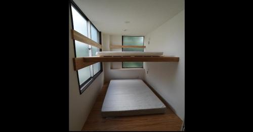 Кровать или кровати в номере Nagoya Hostel The Three Smiles / Vacation STAY 13457