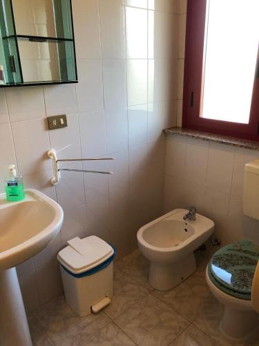 a bathroom with a toilet and a sink at Albergo BELVEDERE in Santa Cristina Gela
