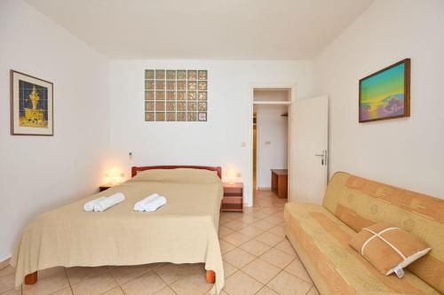 Ένα ή περισσότερα κρεβάτια σε δωμάτιο στο Apartments Hansal