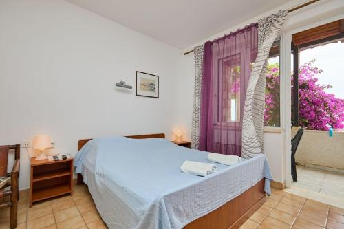 Ένα ή περισσότερα κρεβάτια σε δωμάτιο στο Apartments Hansal