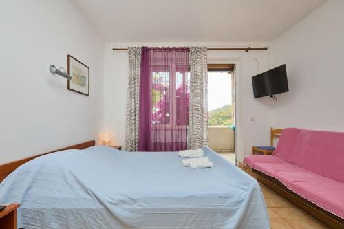 Ένα ή περισσότερα κρεβάτια σε δωμάτιο στο Apartments Hansal