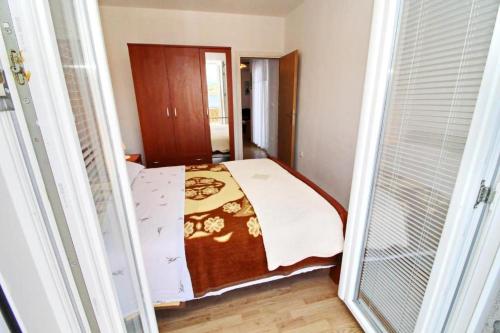 Postel nebo postele na pokoji v ubytování Apartments Nodilo