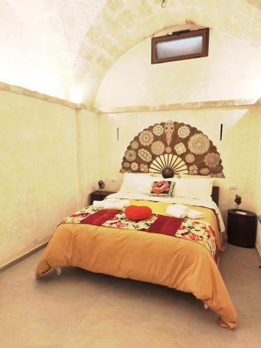 a bedroom with a large bed in a room at Chez Liart 2 in Fasano