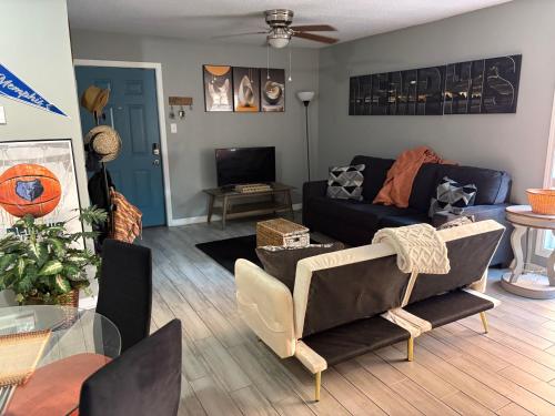 a living room with a couch and a table at Memphis Getaway in Memphis