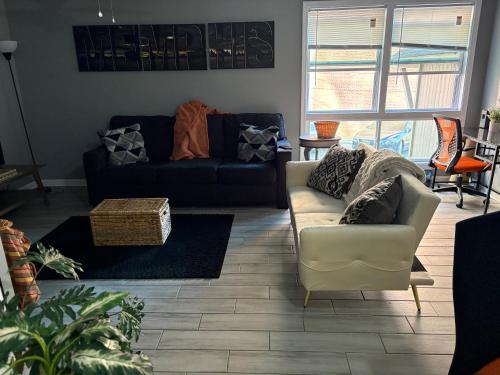 a living room with a couch and a chair at Memphis Getaway in Memphis