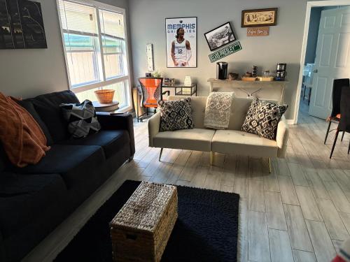a living room with a couch and a coffee table at Memphis Getaway in Memphis
