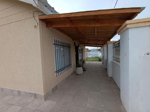 a building with awning over a walkway at Alquiler Temporal Tandil - Xavier in Tandil