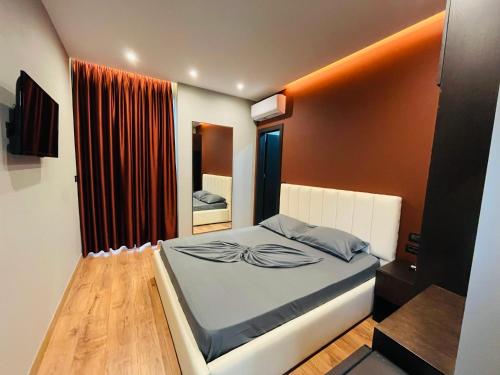 Postel nebo postele na pokoji v ubytování Hotel Nuanti