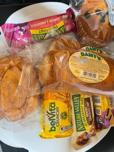 a plate of food with donuts and other snacks at Banlieue Pillars Maison in Mount Vernon