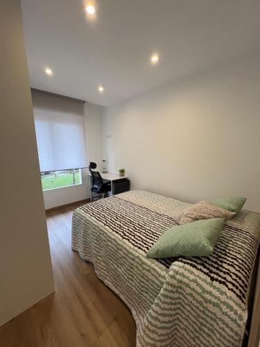 Katil atau katil-katil dalam bilik di Apartamento Miraldobra