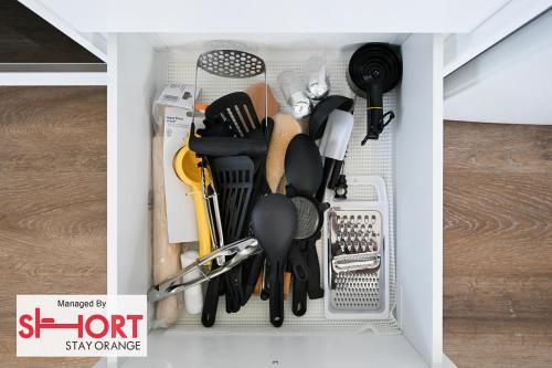 a drawer filled with lots of kitchen utensils at Conservatorium Villa 1 in Orange