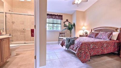 a bedroom with a bed and a bathroom with a shower at 403 Mariners Club in Key Largo