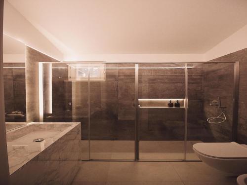 a bathroom with a shower and a toilet at Villa in Apulia with pool near Ionian Sea in Castellaneta