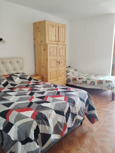 Postel nebo postele na pokoji v ubytování alojamiento la pipi