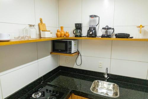 Η κουζίνα ή μικρή κουζίνα στο Japaraty Flats
